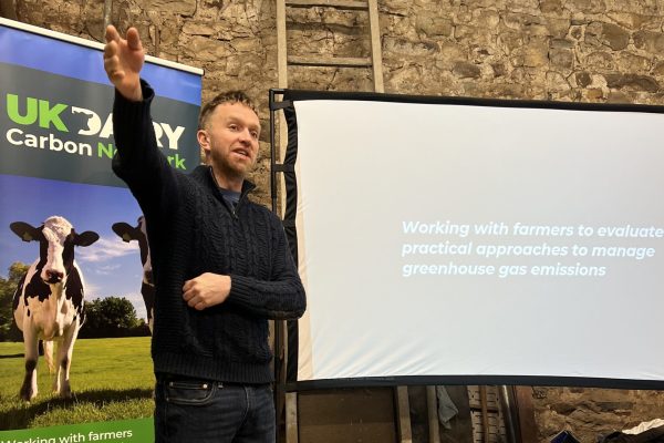Speaker Ben Hartley stood in front of projector