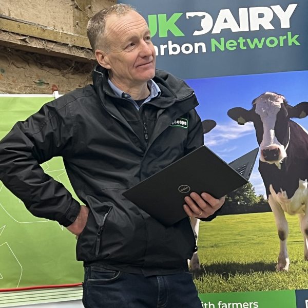 James Bretherton - speaker in front of Uk Dairy Carbon Network advertising banner